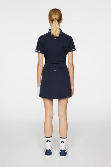 J.LINDEBERG AMELIE MID GOLF SKIRT JL NAVY