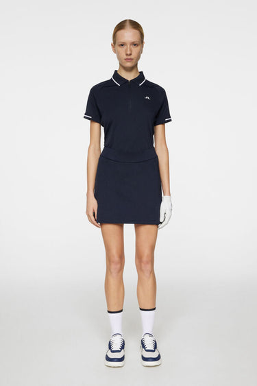 J.LINDEBERG AMELIE MID GOLF SKIRT JL NAVY